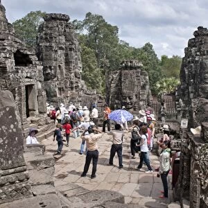 Tourists at The Bayon, Angkor Thom, Angkor, UNESCO World Heritage Site, Siem Reap, Cambodia, Indochina, Southeast Asia, Asia