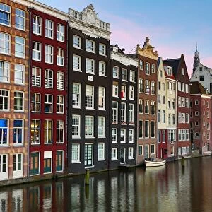 Traditional houses on the Damrak canal in Amsterdam, Holland