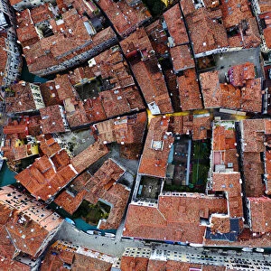 Aerial overhead view of houses and canal, Venice, Italy