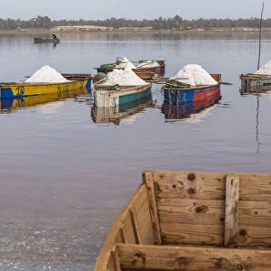 Africa, Senegal, Pink Lake. Salt collecting boats on shore of the lake