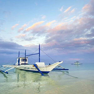Bangka outrigger boat at sunrise on White Beach, Boracay Island, Aklan Province, Western