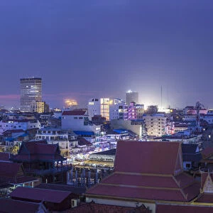 Cambodia, Phnom Penh, elevated skyine along Tonle Sap River, dusk