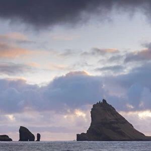 Dramatic outline of Tindhaolmur island at sunset, Vaagar, Faroe Islands, Denmark, Europe