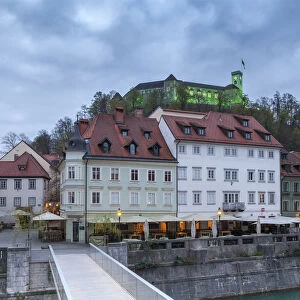 Europe, Slovenia, Ljubljana. Buildings on the Ljubljanica river and the Castle