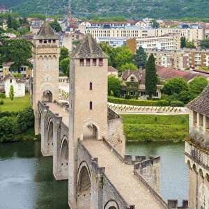 High angle view of medieval Pont Valentre bridge over the Lot River and town