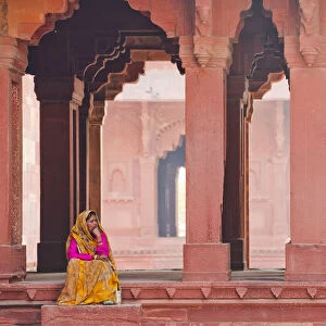 Indian Woman Sitting in Archway, Jodha Bais Palace, Fatehpur Sikri, Agra, India