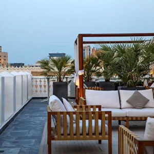 Qatar, Doha, Rooftop terrace of boutiqe hotel at Souq Waqif with Fanar Qatar Islamic