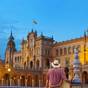 Spain, Andalucia, Seville, Man and woman infront of Plaza de Espana at dusk (MR)