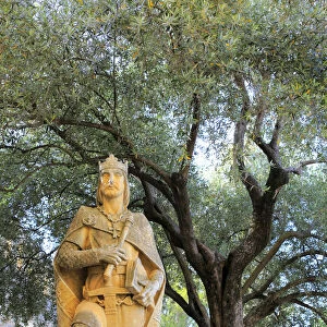 Statue of King Alfonso X at the entrance of Alcazar of the Christian Kings (Alcazar