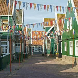 Streets of Marken decorated for Koningsdag, or Kings Day, with flags of Dutch