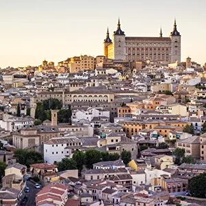 Toledo, Castille - La Mancha, Spain. View of the ancient city at sunset, from a vantage