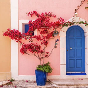 Traditional Greek house colourful front door in the harbour village of Asos, Kefalonia, Ionian Islands, Greece. Summer (June) 2023