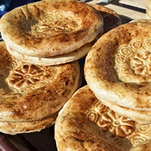 Uzbek bread in the food market. Bukhara, a UNESCO World Heritage Site. Uzbekistan