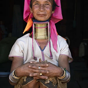 Woman from Kayan tribe wearing traditional brass neck rings, near Loikaw District