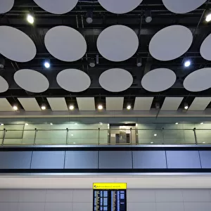 England, London, Heathrow Airport, International Arrivals hall in Terminal 5 with person