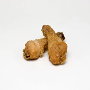 Food, Cooked, Poultry, Two battered chicken drumsticks on a white background