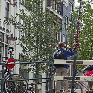 Holland, North, Amsterdam, Padlocks with declarations of love stuck on lifting bridge