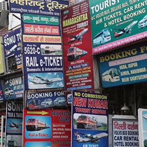 India, New Delhi, Advetisement boards and hoardings for travel services in the Paharganj district of Delhi