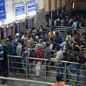 India, New Delhi, Passengers queue at the ticket office in Delhi Junction Railway Station