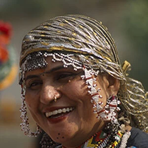 INDIA, Rajasthan, Alwar Portrait of a Kalbelia dancer women smiling at the Alwar Utsav