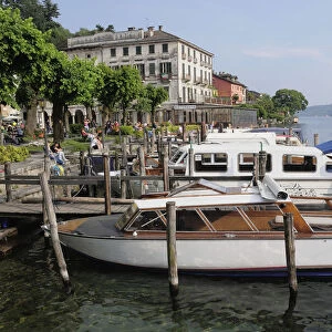 Italy, Lombardy, Lake Orta, Boats berthed along the lakefront, Orta San Giulio