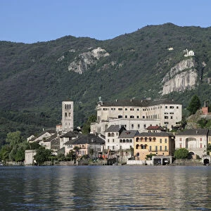 Italy, Lombardy, Lake Orta, Isola San Giulio with Madonna del Sasso behind