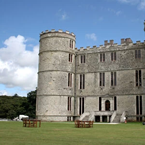 Lulworth Castle with tables and chairs on lawns outside