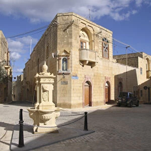 Malta, Gozo, Gharb, old town with stone fountain