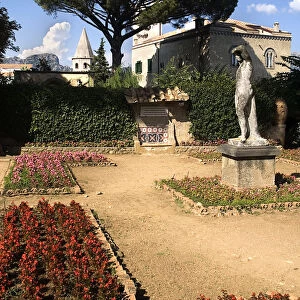 Villa Cimbrone. Statue in walled gardens with Villa Cimbrone behind