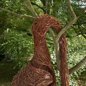 Modern contemporary wicker sculpture in garden of stately home, Chatsworth House, Derbyshire, England, August