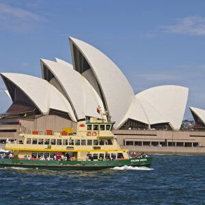 Beautiful closeup of famous Sydney Opera House in Sydney Harbour with ferry passing