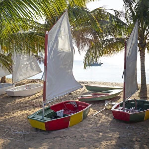 Caribbean, Grenada, Mayreau Island. Sailboats on beach. Credit as