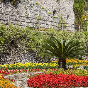 Italy, Campania, Ravello. Flower garden of Villa Rufolo over looking the Amalfi Coast and the Gulf of Salerno