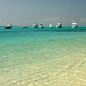 Mauritius, Le Morne. Boats at anchor on a tranquil, tropical lagoon