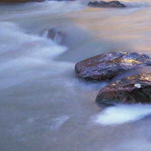 North America, USA, UT, Zion NP sandstone boulders in the Virgin River