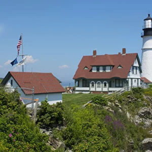 Portland Maine lighthouse famous Portland Head Light white with house on cliff