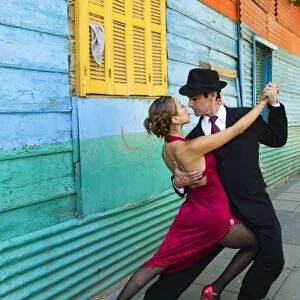 South America, Argentina, Buenos Aires, La Boca. Couple showing one of many tango dance positions
