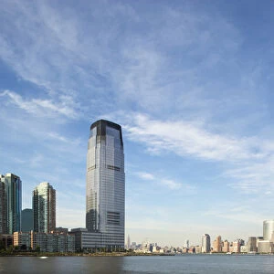 USA, New Jersey, Jersey City, Manhattan skyline rises above Hudson River across