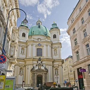 A view down a street in Viennia Austria looking at St. Peters Church