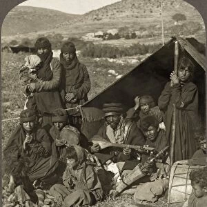 BEDOUIN CAMP, c1919. A group of Bedouin musicians outside their tent, in the Middle East
