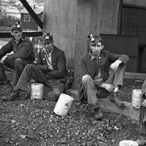 COAL MINERS, 1935. Kentucky coal miners taking a work break, Jenkins, Kentucky