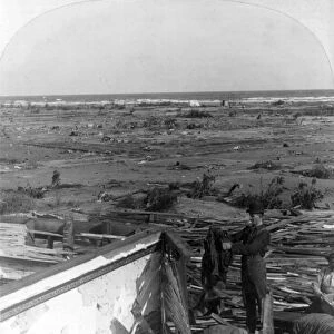 GALVESTON HURRICANE, 1900. A man searching for his belongings after the hurricane