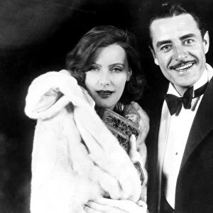 GARBO AND GILBERT, 1927. Greta Garbo and John Gilbert enjoying Hollywood night life, c1927