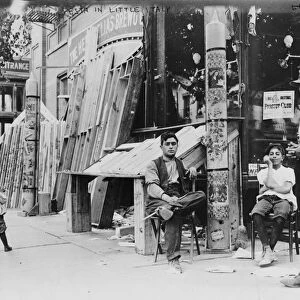 NEW YORK: LITTLE ITALY, 1908. Men and boys outside of a store during a festival in Little Italy