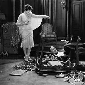 SILENT MOVIE STILL, 1920s. Still from a silent film showing a couple involved in a slapstick accident