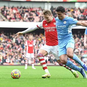 Arsenal's Martin Odegaard Clashes with Manchester City's Rodri: A Premier League Showdown at Emirates Stadium