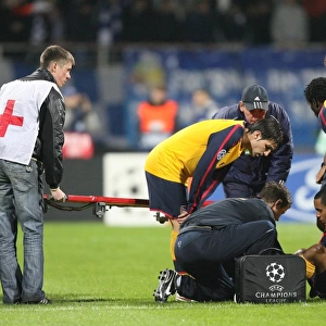 Injured Theo Walcott is treated by Arsenal physio Colin Lewin
