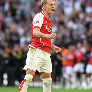 Martin Odegaard Scores the Winning Penalty: Arsenal Claims Community Shield Victory over Manchester City