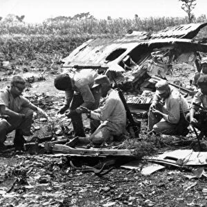 Bay of pigs, 1961, cuban militia examining the wreckage of plane shot down by artillery fire