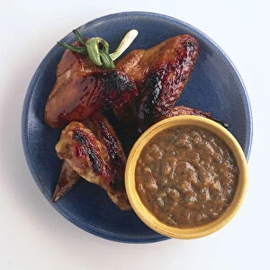 Chicken wings satay on a blue plate